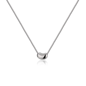 Macro shot of polished S925 sterling silver bean pendant on a delicate box chain necklace