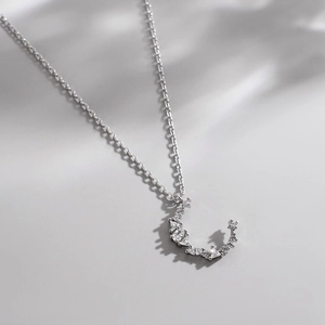 Elegant S925 sterling silver moon necklace featuring sparkling zircon stones on a fine chain
