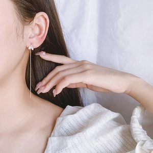 Elegant S925 sterling silver long chain earrings with sprout leaf design on model
