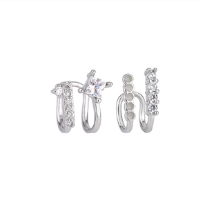 Detail of silver double-layer ear cuffs with square zirconia and small sparkling stones