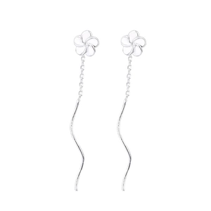 Minimalist silver flower drop earrings with wavy metallic pendants on a clean white backdrop