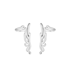 Detail of matte silver antler ear cuffs featuring a textured brushed finish without piercing