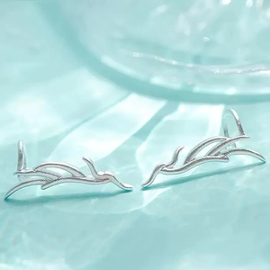 Elegant silver antler-shaped ear cuffs with a matte finish and minimalist branch design