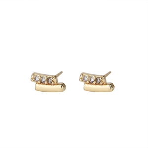 Close-up of geometric double-row earrings with 18K gold plating and cubic zirconia