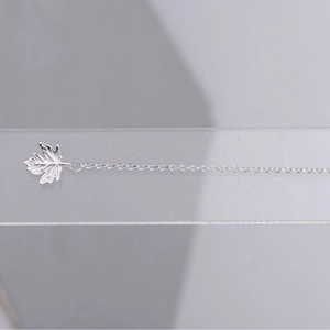 Elegant silver maple leaf tassel drop earrings with delicate long chain design for women