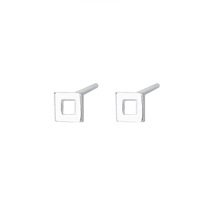 Macro shot of minimalist hollow square sterling silver stud earrings on white background