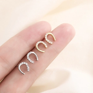 Minimalist U-shaped horseshoe stud earrings with zircon inlay in gold and silver finishes