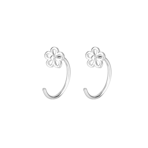 Minimalist C-shaped silver flower hoop earrings with hollow floral design on white background