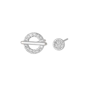 Macro detail of asymmetric S925 silver stud earrings featuring cubic zirconia micro-paving
