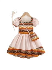 Bohemian girls summer dress with puff sleeves and matching small crossbody bag