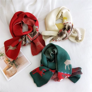 Knitted Christmas scarves in red, white and green featuring festive reindeer and snowflake patterns