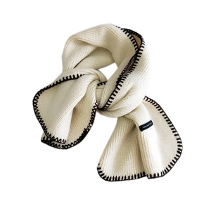 Chic cream knitted scarf with dark edge stitching and minimalist text label for winter