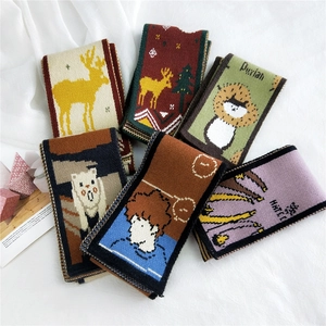 Chic knitted scarf for women featuring cartoon reindeer patterns in various vibrant colors