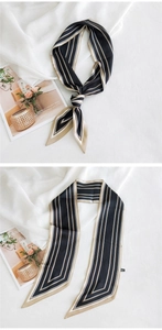 Détail d'un foulard étroit en soie à rayures noires et dorées pour cheveux ou cou