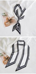 Détail d'un élégant ruban en soie noir et blanc avec motif géométrique de losanges