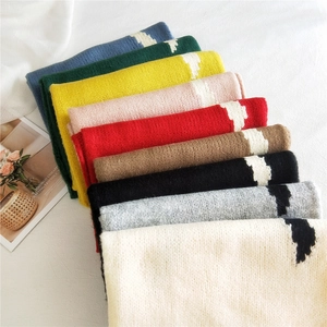 Thick knitted striped scarves in multiple colors with contrast geometric color blocks
