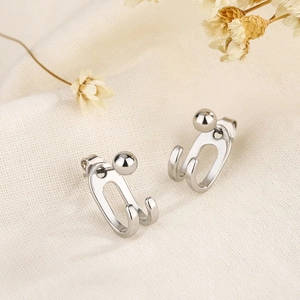 Minimalist S925 silver double-line U-shaped ear jackets on textured beige fabric