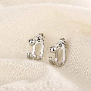 Minimalist S925 silver double-line beaded U-shaped stud earrings on beige fabric