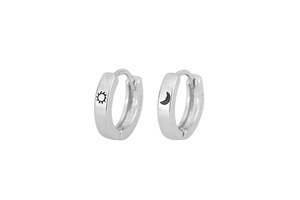 Detailed macro view of S925 sterling silver earrings with sun and moon engravings