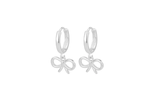 Detailed view of silver bow drop earrings with polished huggie hoop design for women