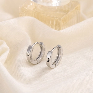 Minimalist S925 sterling silver huggie earrings featuring sun and moon engravings