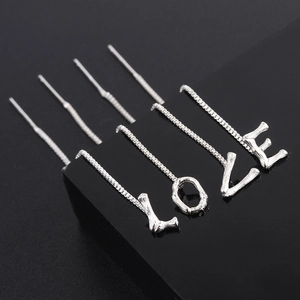 Set of silver letter LOVE earrings with bamboo texture finish and long chain tassels