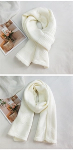 Close-up of chunky knit heart scarf with textured square pattern and thick cozy wool