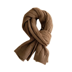 Thick caramel brown knit scarf featuring classic cable pattern for autumn and winter