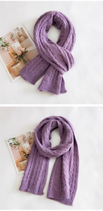 Detail of purple chunky knit scarf showing thick cable weave and soft ribbed edges