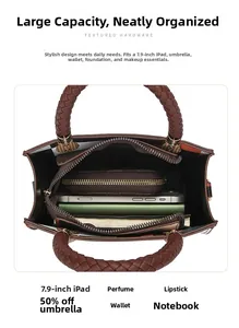 Detail view of spacious brown tote bag interior with plaid lining and daily essentials