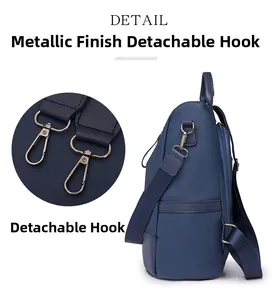 Detail view of lychee texture leather backpack with bronze detachable hooks