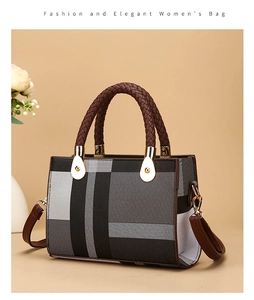 Detail of woven fabric pattern and braided handle on a tricolor minimalist tote bag