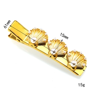 Detail of golden shell hair clip with pearls and clip mechanism dimensions 61mm
