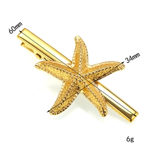 Gold starfish hair clip in polished metal for beach style accessories, 60mm length
