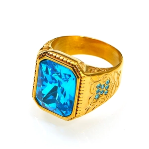 Golden hip hop ring with rectangular blue gemstone and vintage floral carvings on band