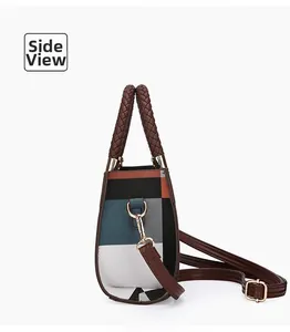 Side view detail of a geometric patchwork shoulder bag with gold-tone metal hardware