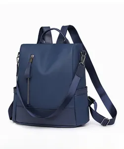 Side view of dark blue PU leather backpack with lychee grain texture and zipper details