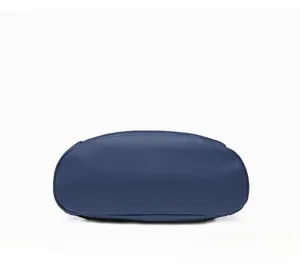 Detailed bottom view of navy blue PU leather backpack with pebble grain texture and stitching