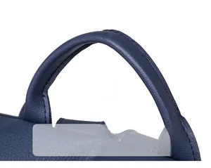 Detail view of the soft PU leather handle with reinforced stitching on the blue backpack