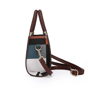 Modern color-block handbag with woven handle and adjustable strap in navy and orange