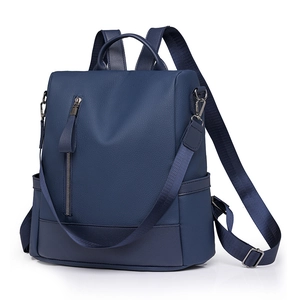Deep blue PU leather backpack with荔枝 texture and convertible shoulder straps for travel