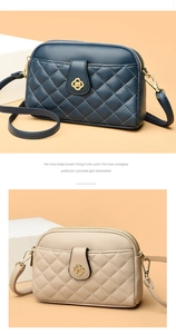 Close-up of quilted leather bags with gold flower clasp and double zipper structure