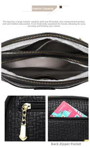 Detail of black pebbled leather bag with multi-layer zipper and herringbone fabric lining