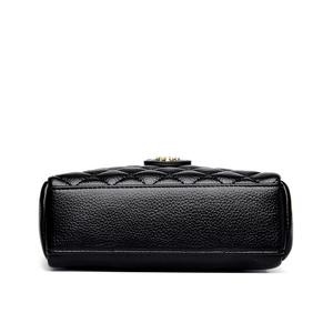 Classic black quilted leather crossbody bag with elegant gold circular hardware detail