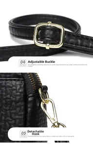 Close-up of black lychee grain leather strap with adjustable gold buckle and spring hook