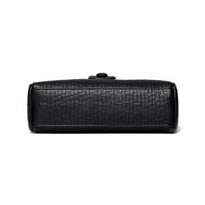 Black pebbled leather shoulder bag with fine stitching and circular metal clasp