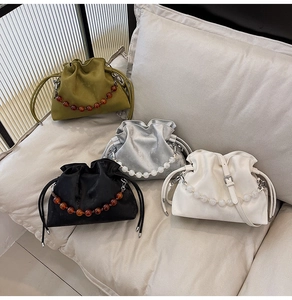 Chic drawstring bucket bags in green, grey, black and white with decorative beaded handles