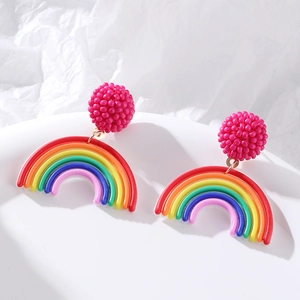 Rainbow bead drop earrings with pink spherical studs on white textured display base