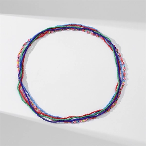 Detailed close-up of multilayer colorful glass waist beads with floral bohemian charms