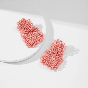 Handmade pink beaded earrings featuring a double layered geometric rectangular design